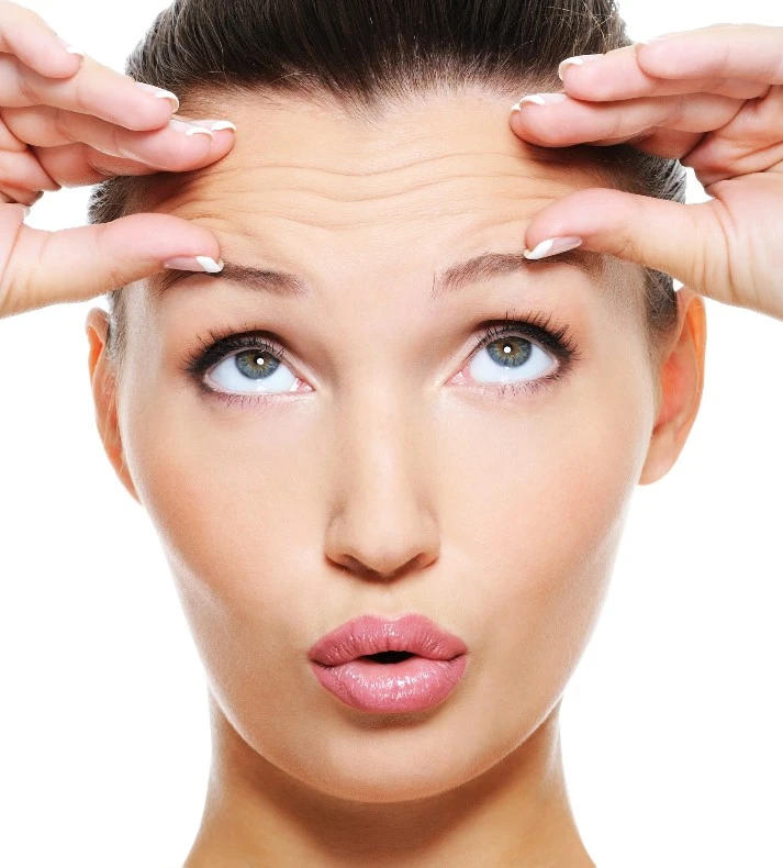 Woman Showing Forehead Wrinkles Before Wrinkle Relaxer Treatment in Woodmere, Ohio | EG Aesthetics