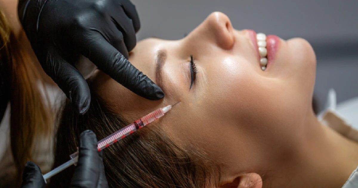 Woman Receiving Temple Filler Treatment by EG Aesthetics in Woodmere, OH